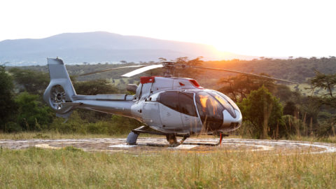 helicopter at sunrise in the masai mara