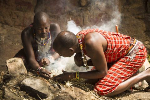 Masai people lighting a fire