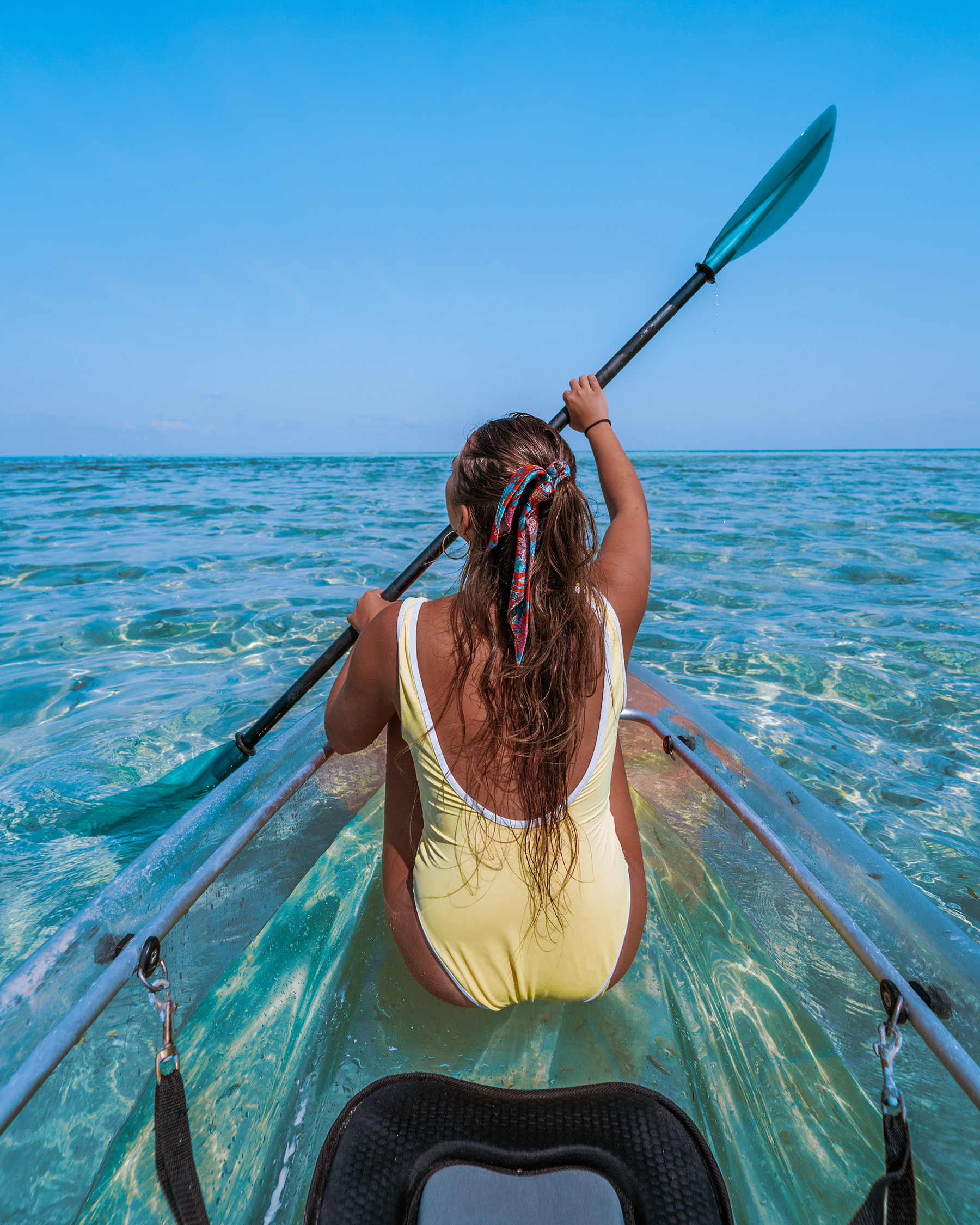 a lady rowing a small boat