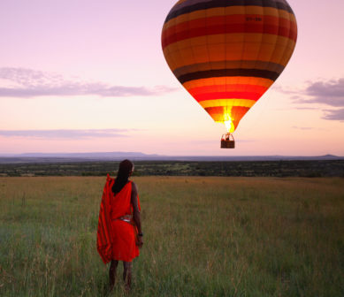 a masai warrior and a hot air balloon